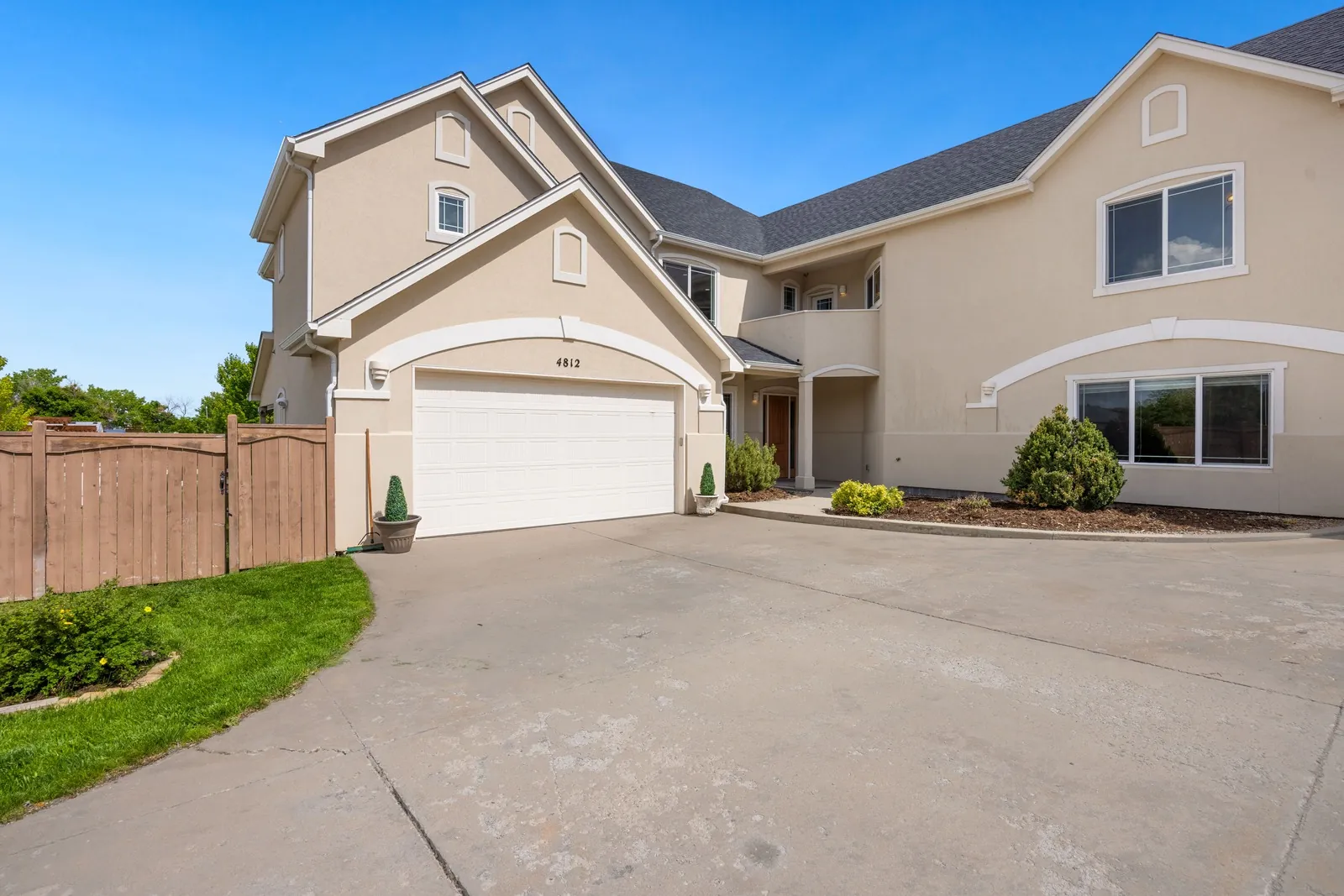 Two-storey house with an attached garage and driveway